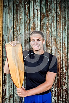 Portrat of young canoeist holding paddle. Concept of canoeing as dynamic and adventurous sport. photo