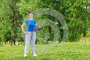 Portret of Senior Woman Exercising In Park. Elderly female doing fitness exercises outdoor. Heathy life style concept