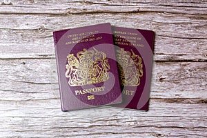 02-08-2021 Portsmouth, Hampshire, UK a pair Of British passports laid on a wooden table