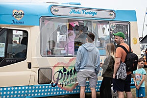08/04/2019 Portsmouth, Hampshire, UK people queuing to buy an ice cream from an ice cream van