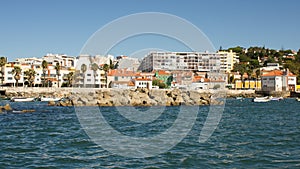 Portugal, coastal road (Estrada Marginal) between Lisboa, Estoril and Cascais viewd from the sea photo