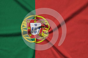 Portugal flag is depicted on a sports cloth fabric with many folds. Sport team banner