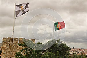 Portugal flag waving under cloudy sky