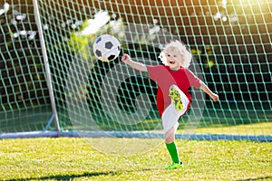 Portugal football fan kids. Children play soccer.