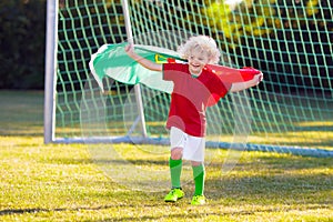 Portugal football fan kids. Children play soccer