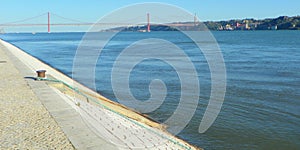 Portugal, Lisbon, Prasa do Imperio, view of the waters of the bay and the 25th of April Bridge photo