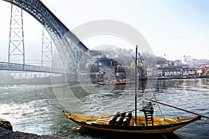 Portugal, Porto - OCTOBER 06, 2016: old Rabelo boats with wine barrels have traditionally been used for the transport of port on