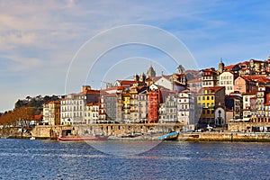 Portugal, Porto old town ribeira aerial promenade view with colorful houses, Douro river and boats.Concept of world travel,