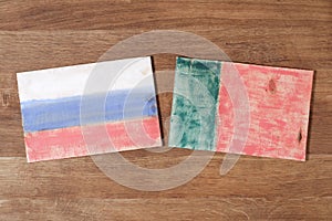 Portugal and Russia flag, concept cooperation friendship on wood background.