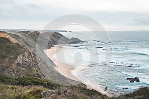 Portugal\'s western coastline of rocky cliffs and sandy beaches in the Odemira region. Wandering along the Fisherman trail