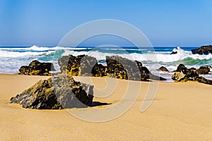 Portugals sandy beach on rocky Atlantic coast. Adraga beach
