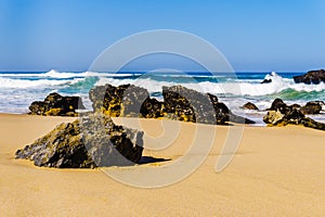 Portugals sandy beach on rocky Atlantic coast. Adraga beach photo