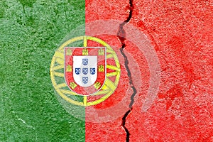 Portugese flag on a cracked wall-politics, war, conflict concept