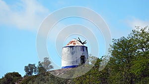 Portugese windmill at fortified medieval town Obidos in Portugal photo