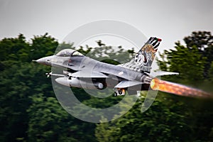 Portuguese Air Force F-16 fighter jet taking off with afterburner from Mont-de-Marsan airbase during the NATO Tigermeet. Mont-De-