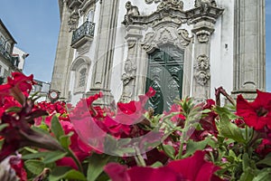 Portuguese ancient building with roses in the foreground photo