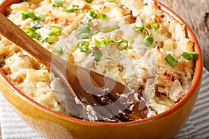 Bacalhau com natas cod with potatoes and cream in a baking dish