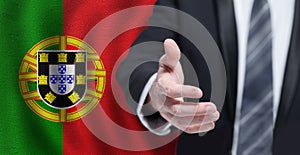 Portuguese business, politics, cooperation and travel concept. Hand on flag of Portugal background