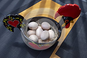 Portuguese ceramics, Barcelos cock, rooster, on a table, Galo de Barcelos photo
