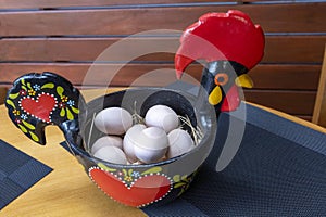 Portuguese ceramics, Barcelos cock, rooster, on a table, Galo de Barcelos photo