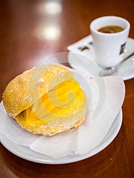 Portuguese Doughnut Or Berliner With Egg Creme And Coffee photo