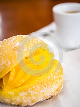 Portuguese Doughnut Or Berliner With Egg Creme And Coffee photo