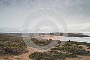 Portuguese landscape of endless plains and sandy beaches along the rocky cliffs of the Odemira region. Wandering along the photo