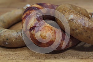 Portuguese smoked sausage  alheira and chorizo on wooden board photo
