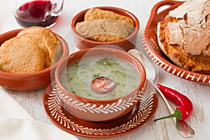 Portuguese soup caldo verde in ceramic dish photo