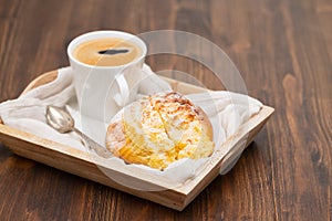 Portuguese sweet bread pao de deus with cup of coffee photo