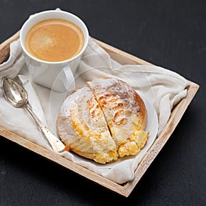 Portuguese sweet bread pao de deus with cup of coffee photo