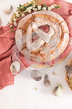 Portuguese traditional Easter cake with eggs. Typical Folar de Vale de Ilhavo, Aveiro, Portugal. Blossom flowers and colorful