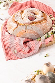 Portuguese traditional Easter cake with eggs. Typical Folar de Vale de Ilhavo, Aveiro, Portugal. Blossom flowers and colorful