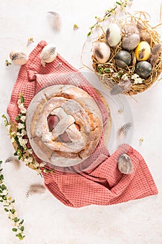 Portuguese traditional Easter cake with eggs. Typical Folar de Vale de Ilhavo, Aveiro, Portugal. Blossom flowers and colorful