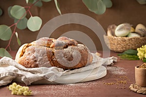 Portuguese traditional Easter cake with eggs. Typical Folar de Vale de Ilhavo, Aveiro, Portugal. Blossom flowers and colorful