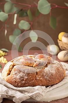 Portuguese traditional Easter cake with eggs. Typical Folar de Vale de Ilhavo, Aveiro, Portugal. Blossom flowers and colorful