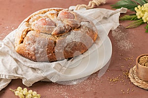 Portuguese traditional Easter cake with eggs. Typical Folar de Vale de Ilhavo, Aveiro, Portugal. Blossom flowers and colorful