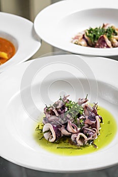 Portuguese traditional fresh seafood marinated squid salad in coriander oil photo