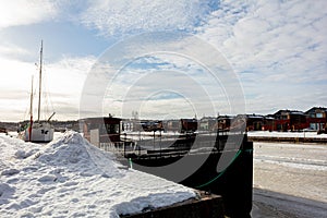 Porvoo, Finland, March 3, 2021. Ships on the winter river..ship for the winter. River pier in winter on a frozen river