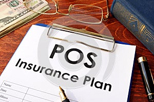 POS Insurance Plan on a table.