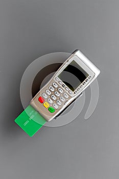 Pos payment terminal with credit card. Paying for shopping. E-commerce and business