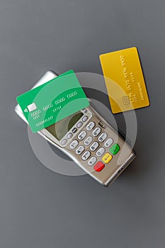 Pos payment terminal with credit card. Paying for shopping. E-commerce and business