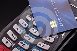 POS terminal, Payment Machine with credit card on black background