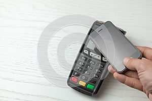 POS terminal, Payment Machine with mobile phone on white background. Contactless payment with NFC technology.