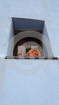 Posada, Italy, August 1 2021. A terracotta snail on a window sill