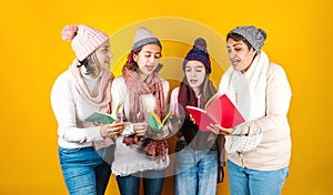 Posada Mexicana, Mexican family Singing carols at Christmas, three generations of women in Mexico Latin America