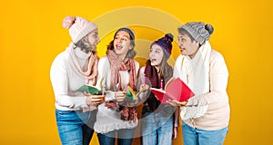 Posada Mexicana, Mexican family Singing carols at Christmas, three generations of women in Mexico Latin America