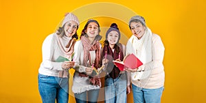 Posada Mexicana, Mexican family Singing carols at Christmas, three generations of women in Mexico Latin America