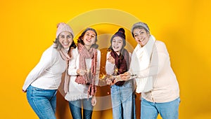 Posada Mexicana, Mexican family Singing carols at Christmas, three generations of women in Mexico Latin America