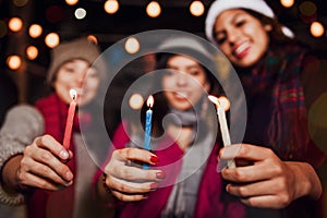 Posada Mexicana, Mexican friends with candles celebrating Christmas in Mexico